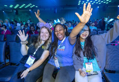 Three students celebrating at PTK Catalyst 2024.