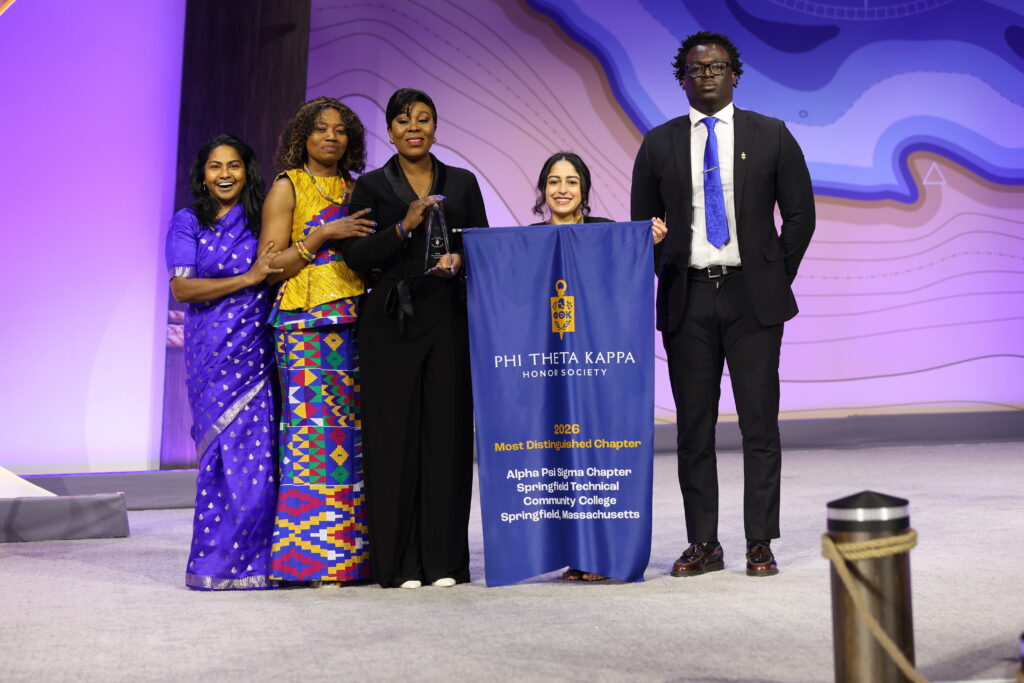 Alpha Psi Sigma Chapter receiving Most Distinguished Chapter Award.