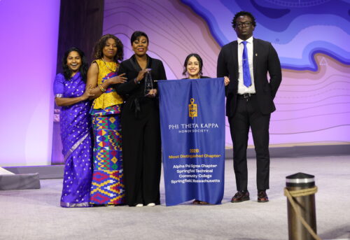 Alpha Psi Sigma Chapter receiving Most Distinguished Chapter Award.